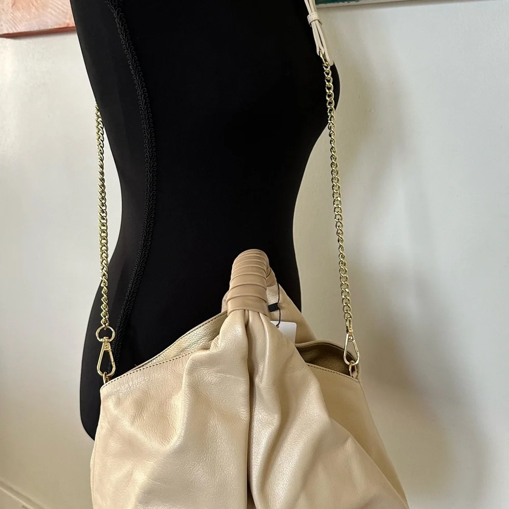 NWT gorgeous gold leather handbag. Detachable shoulder strap. Gold and beige